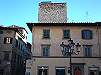 Foto 29 - Veduta laterale, da piazza Duomo, della torre all’ingresso di via Garibaldi.