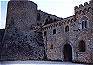 Ingresso del castello, con torrione cilindrico (XI-XIII sec.?) e facciata (XVI sec.)
