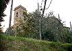 Il retro della rocca di Tizzana dove si scorge la torre campanaria della chiesa.